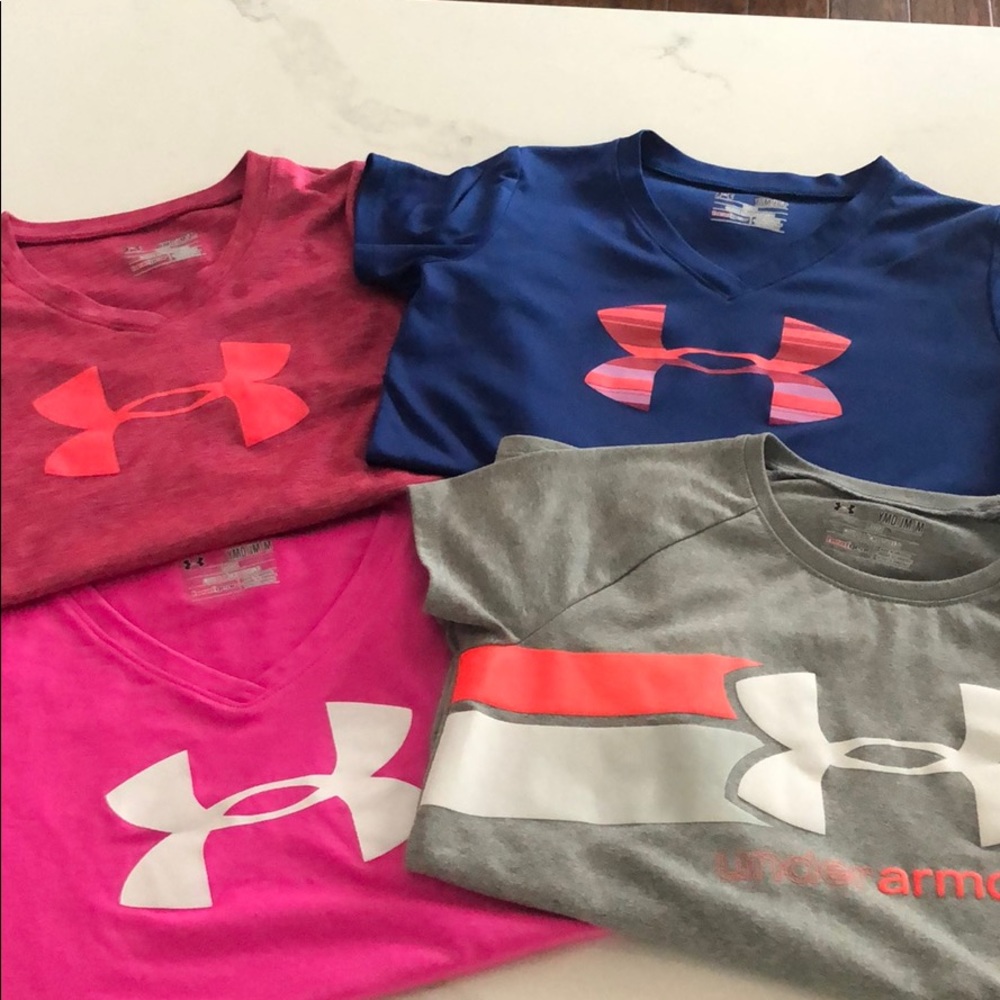 Lot of 4 girls Under Armour shirts.